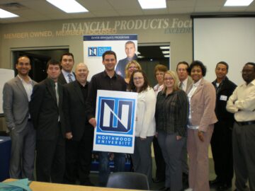 A group of Northwood University alum from the Lansing chapter posing for a photo