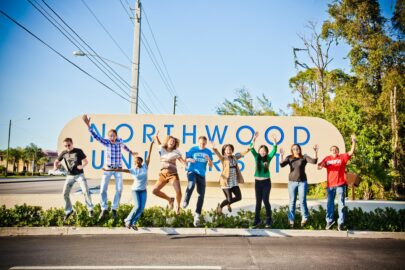 A group of Northwood University alum from the West Palm Beach chapter posing for a photo