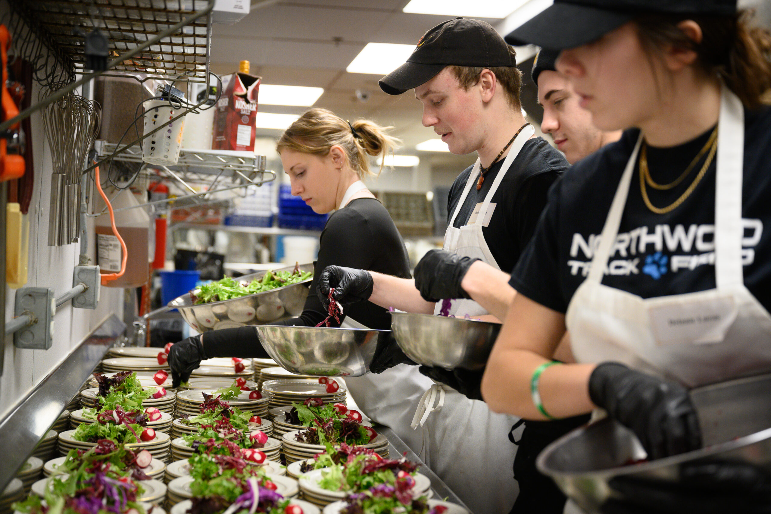 Students prepping food for the Stafford Dinner
