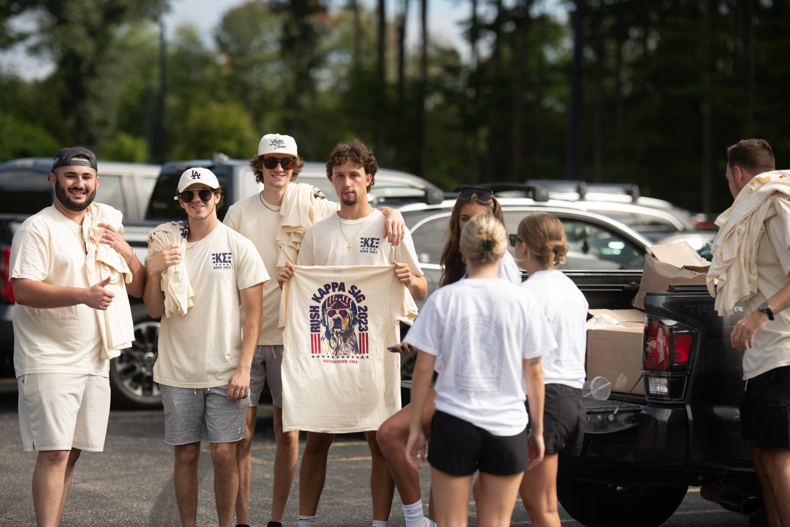Kappa Sigma holding T-shirts on Freshman move-in day