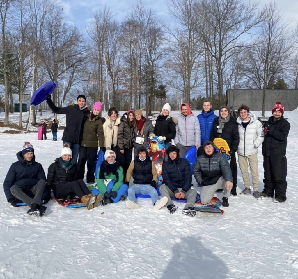 International students experiencing sledding in the snow