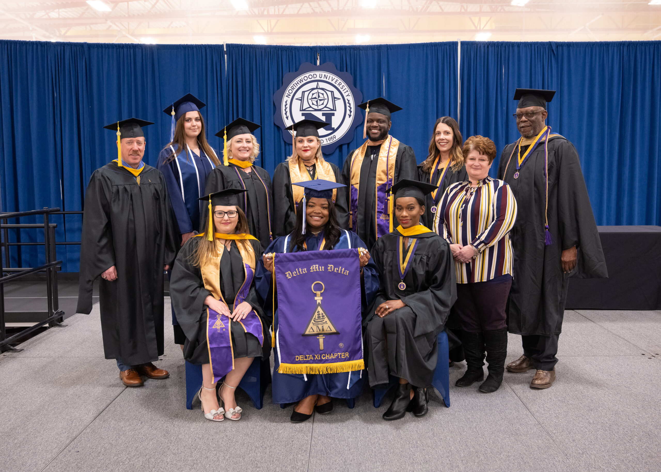 Honors graduates from Delta Mu Delta at graduation