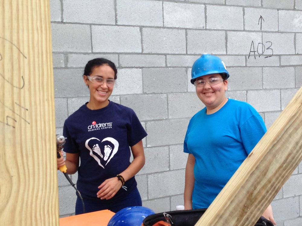 Northwood students Angelica Diaz-Martinez (left) and Melanie Gil volunteer at the Habitat for Humanity project.