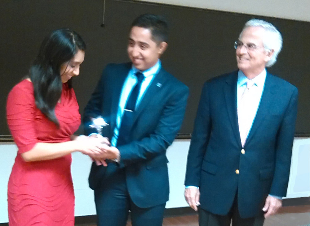 Pitch Competition - C - Professor George Stamas (left) congratulates Sirenia Cebrero and Pablo Hernandez