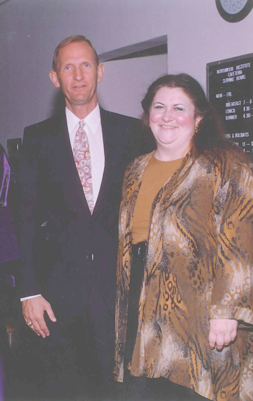 Professors Mike Tuttle and Cheryl Pridgeon enjoy a commencement ceremony in the early 1990's.