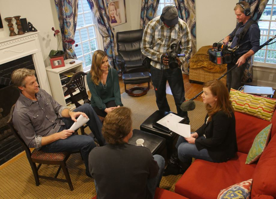 UPtv crew members film as Taepke (right) works with Penn and Kim Holderness (left) on a client pitch.