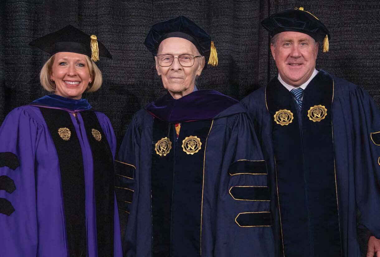 Robert J. “Bob” Chitester receives an honorary Doctor of Laws Honoris Causa degree from Northwood University Academic Vice President &amp; Provost Kristin Stehouwer and President Kent MacDonald.