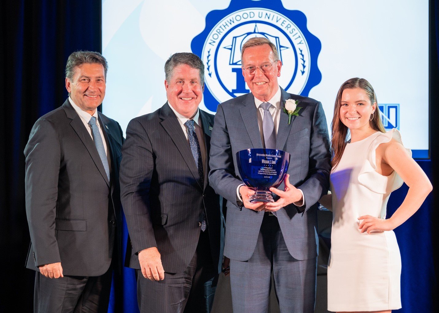  From left, Northwood University Board of Trustees Vice Chair Steve Madincea; President Kent MacDonald; 2022 OBL William J. Long; and Elisse Richardson, a Northwood student who introduced Long. 