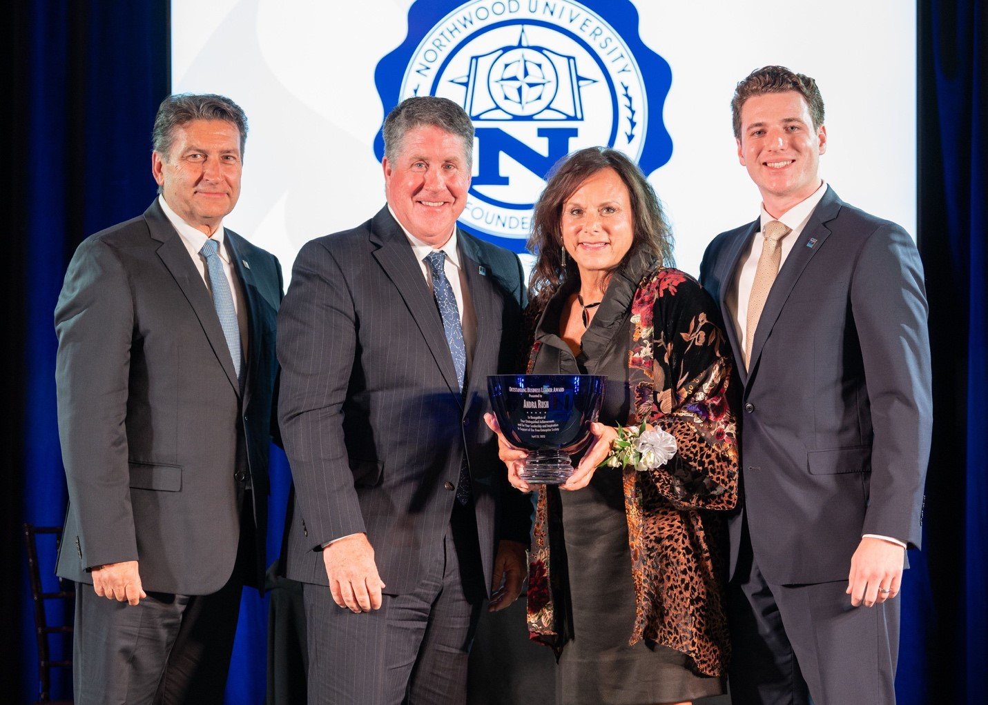  From left, Northwood University Board of Trustees Vice Chair Steve Madincea; President Kent MacDonald; 2022 OBL Andra Rush; and Jared La Rue, a student who introduced Rush. 