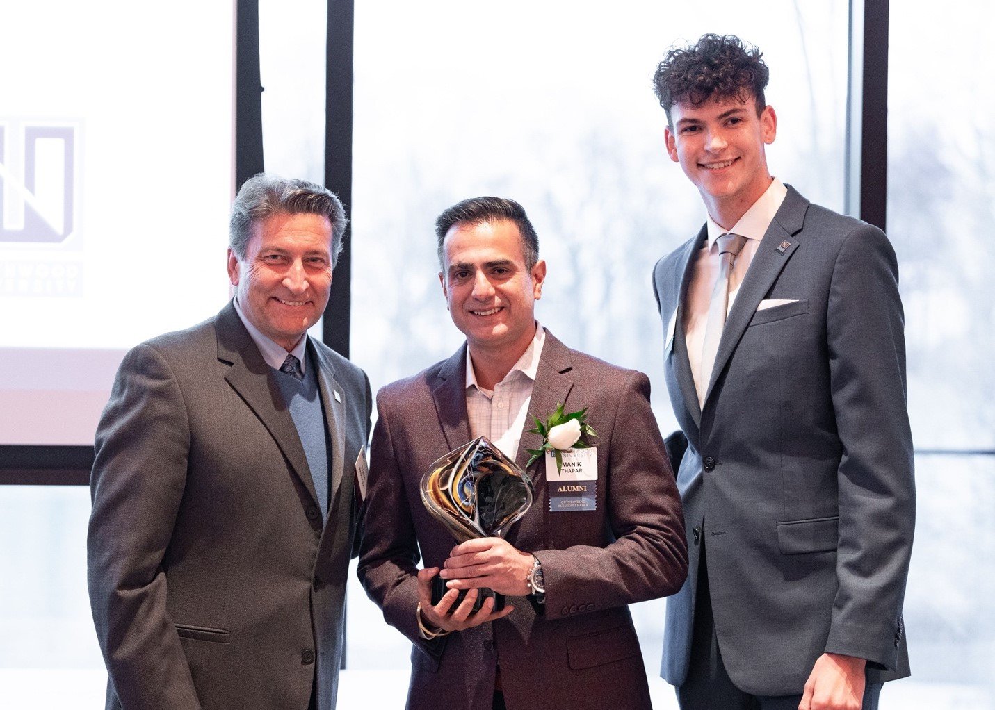  From left, Northwood University Board of Trustees Vice Chair Steve Madincea; Manik Thapar, the 2022 Richard DeVos Young Entrepreneur Award winner; and Aidan Jones, a Northwood student who introduced Thapar during a keystone reception held in his hon