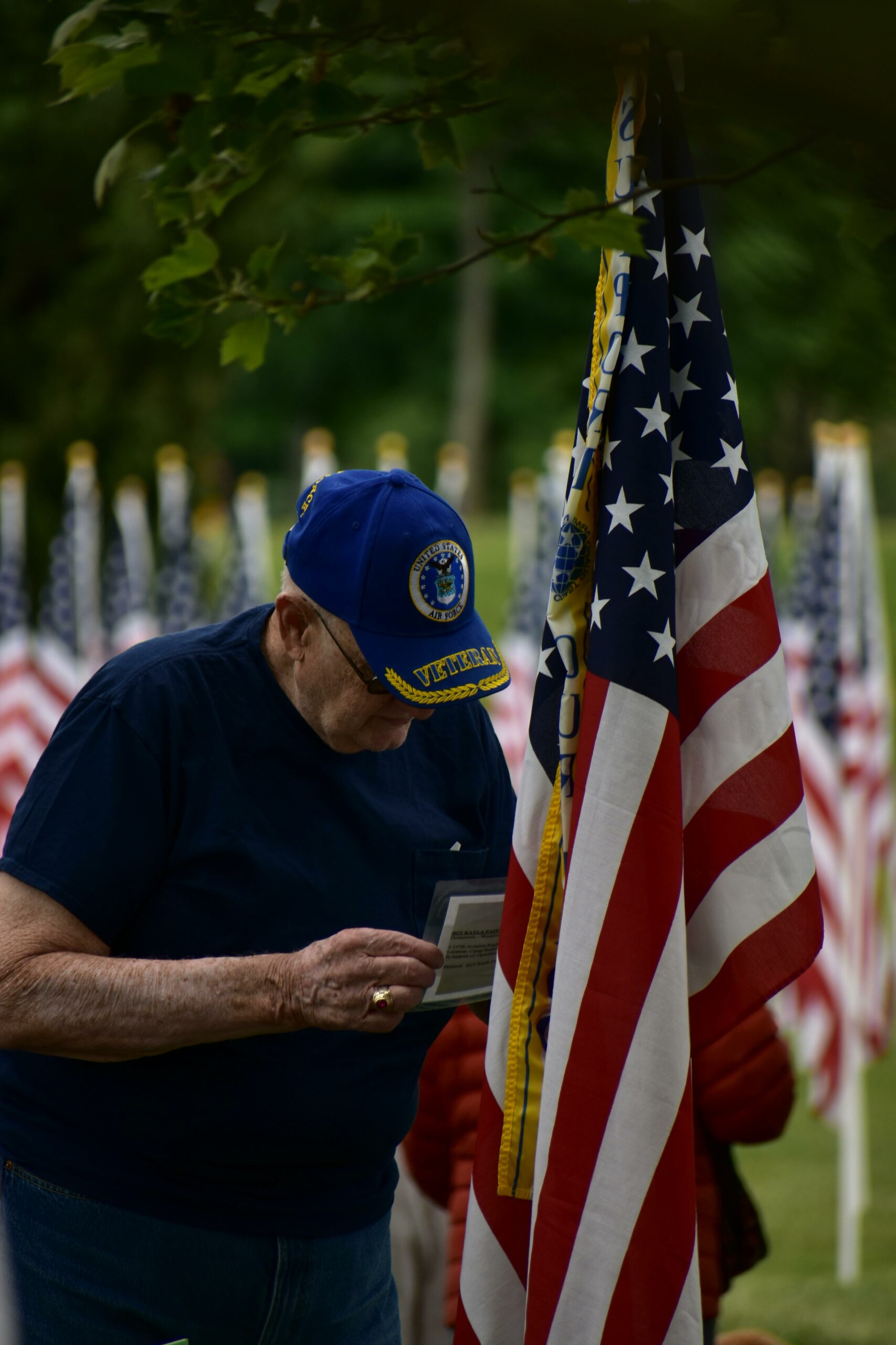 Older Veteran looking at the American Flag